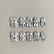 Silver chrome press-on nails with a checkered mirror effect