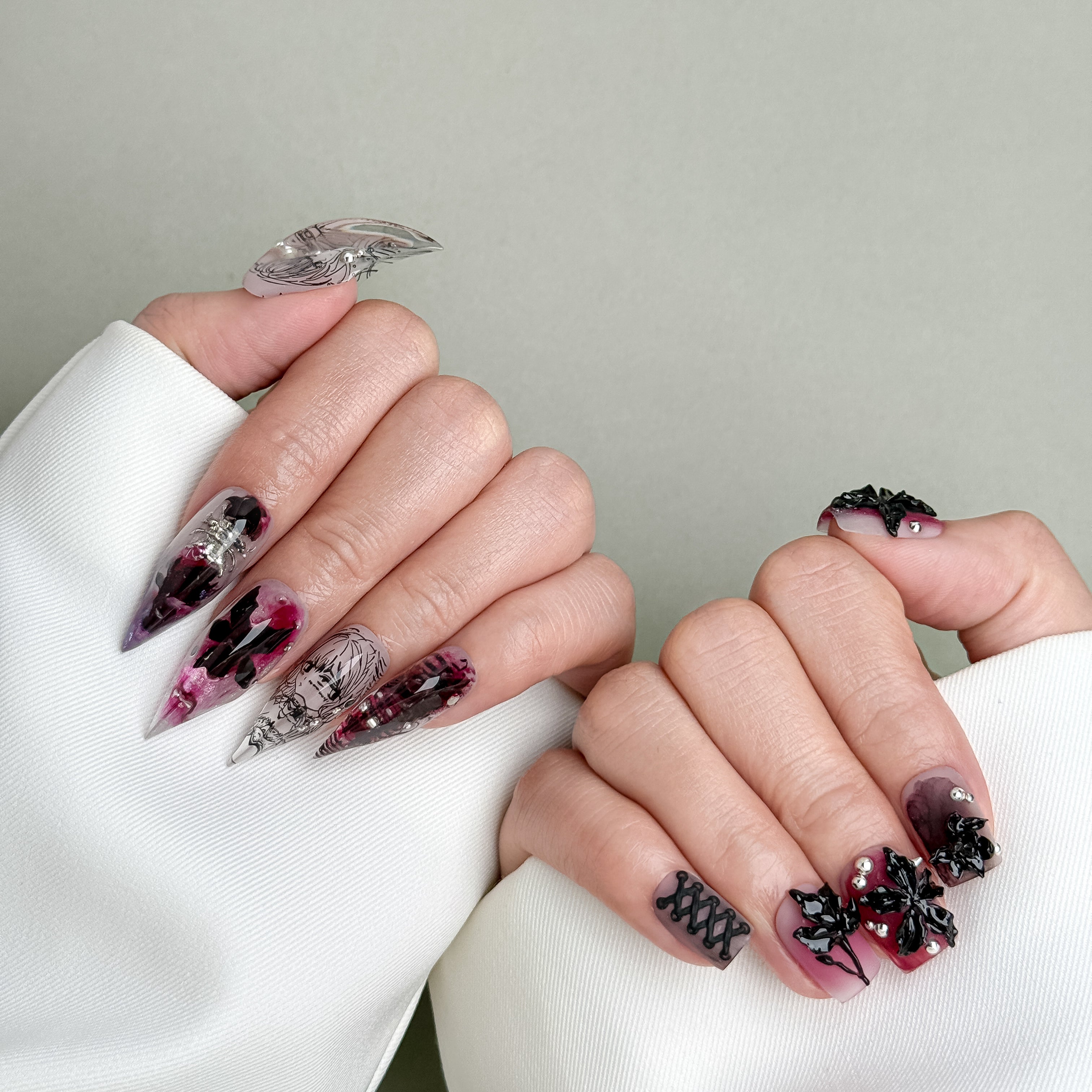 Model wearing And Just Like That nails with dramatic gradient and gem details