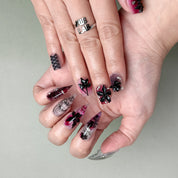 Another angle showing nail texture and reflective finish