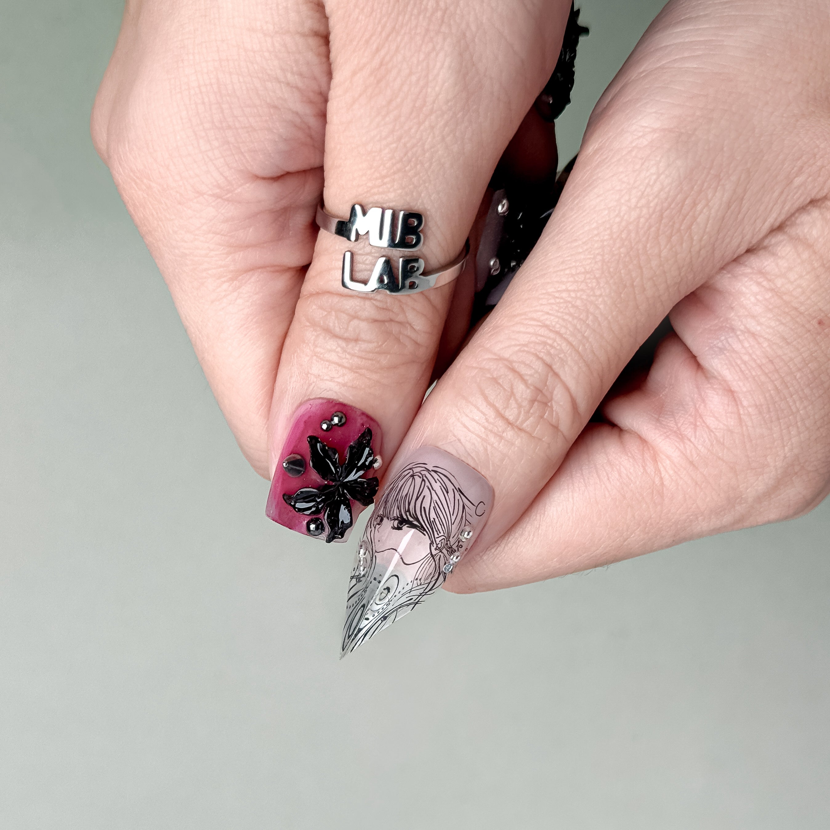 Artistic hand pose emphasizing the bold, luxurious nail design