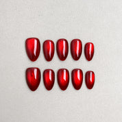 Set of reusable press-on nails in metallic cherry red with glossy finish, MIBLAB Merry Me collection Geneva.
