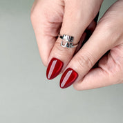 Close-up of metallic red press-on nails by MIBLAB, handcrafted high-shine design from the Merry Me collection Geneva.