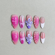 Pink and white ombr¡§| press-on nails with purple 3D floral accents