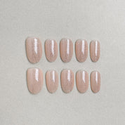 Set of reusable press-on nails in soft nude beige with subtle pearlescent finish, MIBLAB You and Me collection Geneva.