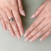 Close-up of nude beige pearlescent press-on nails by MIBLAB, luxury handcrafted design from the You and Me collection Geneva.